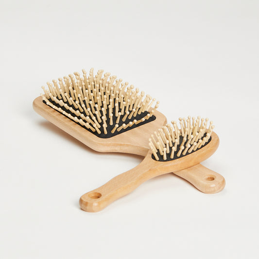 Hairbrush with round wooden knobs