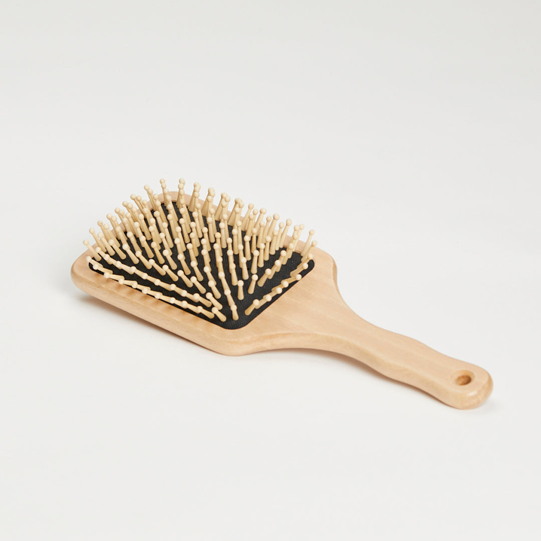 Hairbrush with round wooden knobs